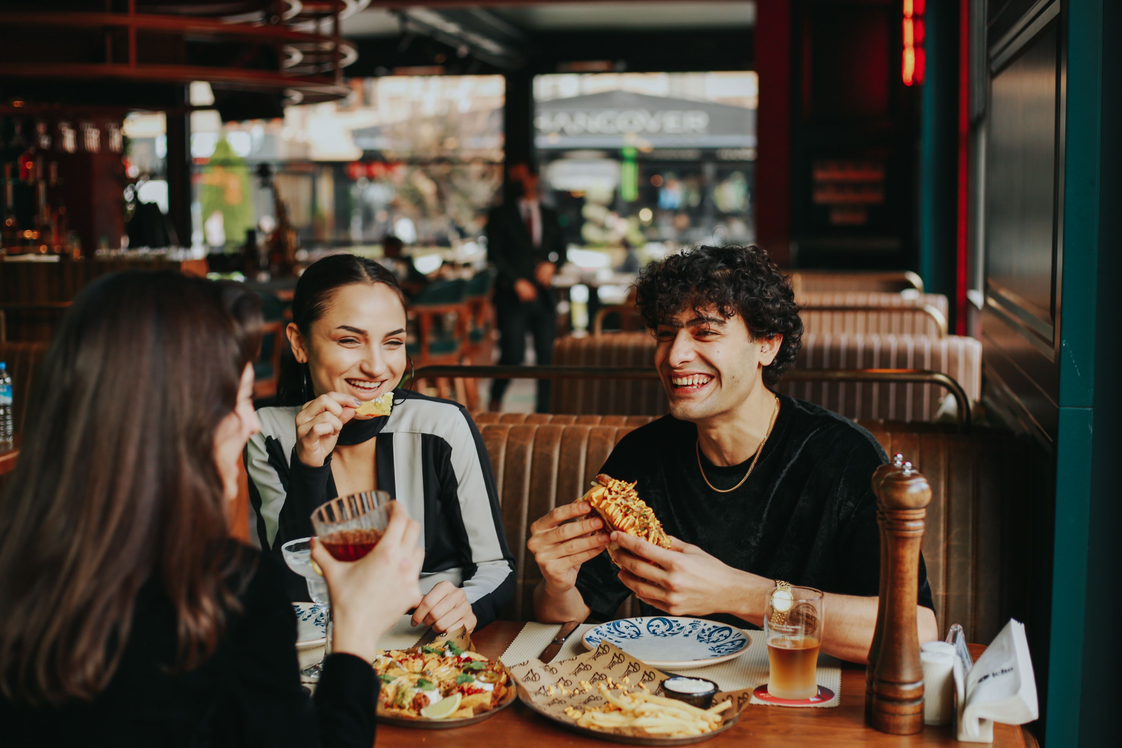 Friends splitting a restaurant bill after dinner